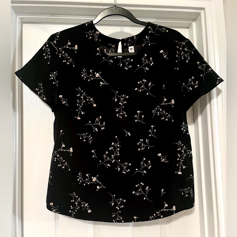 Black top with delicate flower patterning
